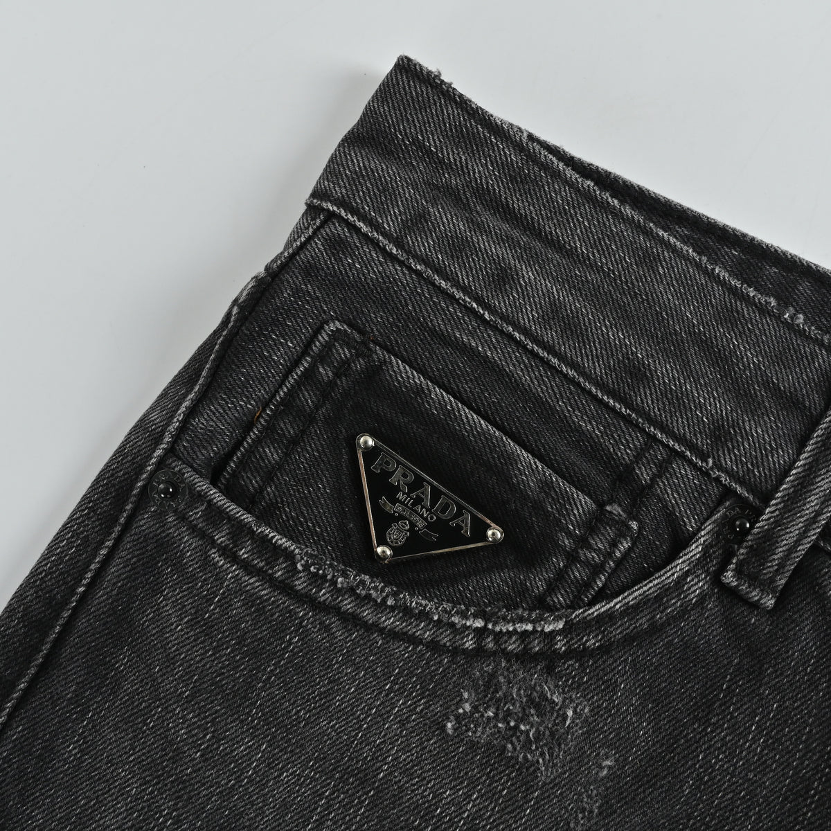 Prada 23FW Triangle Logo Embroidered Washed Slim Jeans – Charcoal  XM5200103