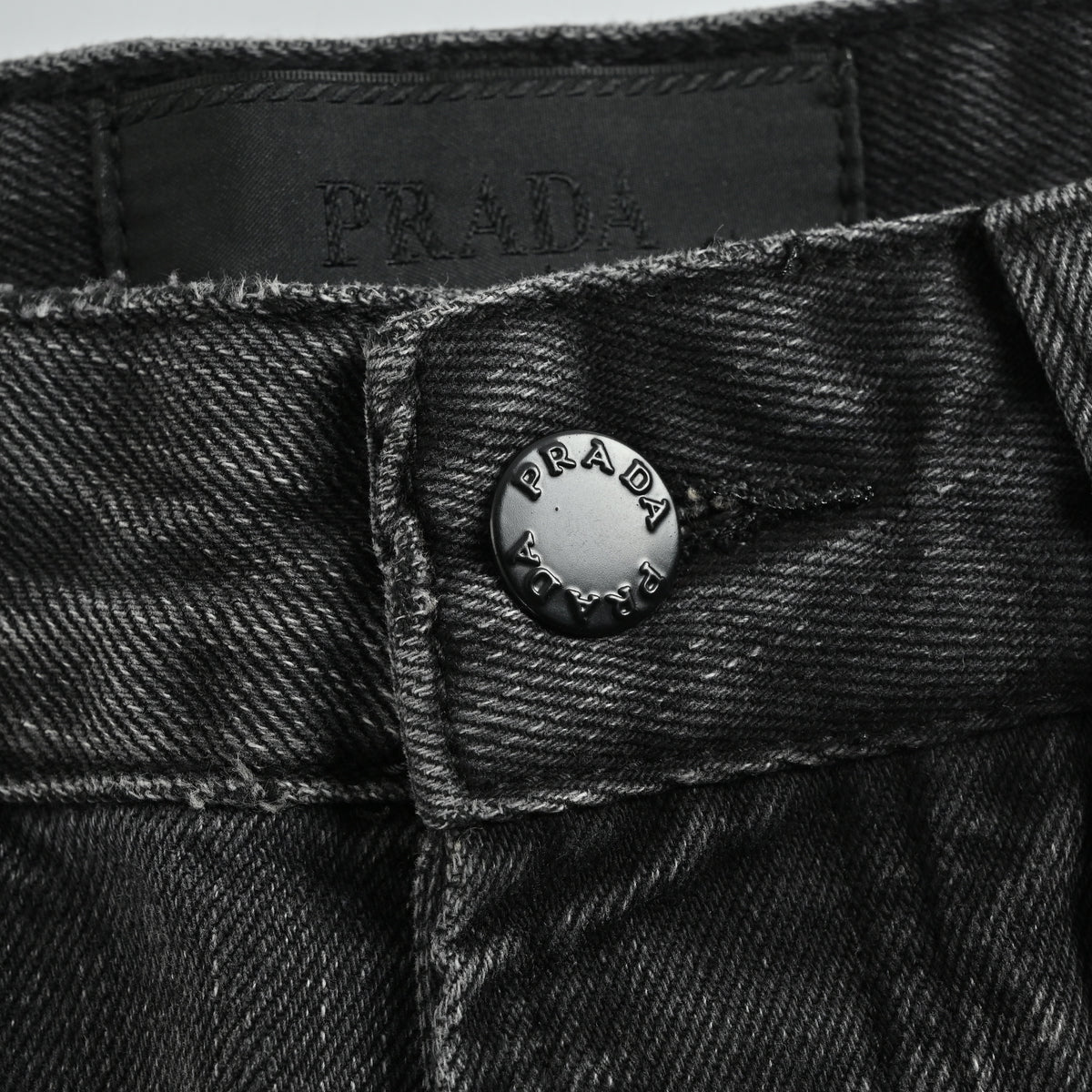 Prada 23FW Triangle Logo Embroidered Washed Slim Jeans – Charcoal  XM5200103